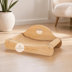 May include: A light-colored wooden pet bed featuring a curved back panel with a cat-shaped cutout and a textured sisal scratching surface. The structure is held together by metal screws and includes a circular logo sticker reading ZENVORA COLLECTIONS.