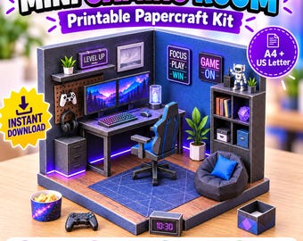Puede incluir: Un kit de manualidades en papel imprimible para una mini sala de juegos con escritorio, dos monitores, silla gamer, puf, estantería y decoración de pared. El set incluye textos como 'MINI GAMING ROOM', 'LEVEL UP', 'FOCUS PLAY WIN', 'GAME ON' y '10:30'.