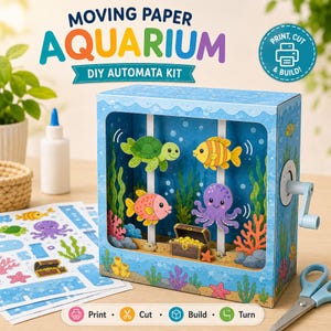 Peut inclure: Un kit d'automates en papier intitulé Moving Paper Aquarium comprenant une boîte bleue avec une manivelle. À l'intérieur se trouvent des découpages en papier d'une tortue verte, de poissons, d'une pieuvre violette et d'un coffre au trésor.