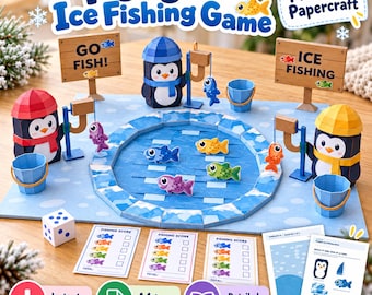 Puede incluir: Un juego de pesca en hielo de papel con tres figuras de pingüinos con gorros, un estanque circular, peces de papel coloridos, cañas de pescar, cubos, un dado, tarjetas de puntuación e instrucciones. Letreros dicen Go Fish e Ice Fishing.