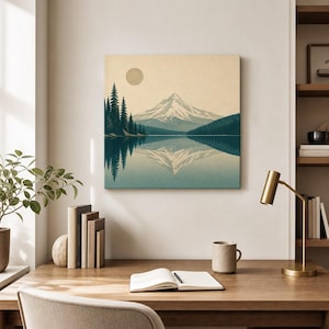May include: A square wall art print featuring a snow-capped mountain peak reflected in a calm lake. A dense forest of dark teal pine trees stands on the left shore under a pale beige sky with a circular sun. The color palette includes muted blues, greens, and cream tones.