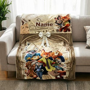 May include: A soft fleece blanket featuring a Zootopia character collage over a vintage newspaper print background. The design includes a central cream-coloured bow, an archway graphic, and the word Name printed in a dark brown serif font.