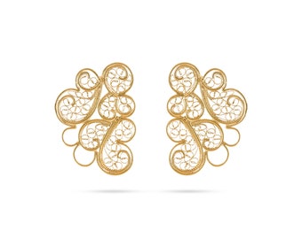 May include: A pair of gold filigree earrings with a delicate, intricate design. The earrings are made of thin, twisted wire that is woven together to create a floral pattern.
