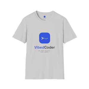 May include: A light grey short-sleeved t-shirt featuring a blue square icon with a white command line prompt symbol. Below the icon, the text reads VibedCoder followed by the smaller text No code reviews. Just vibes. in a dark grey font.