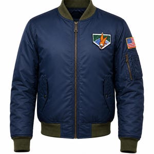 May include: A navy blue bomber jacket featuring a ribbed olive green collar, cuffs, and hem. The jacket has a central metal zipper, two side pockets, and a zippered utility pocket on the left sleeve. A patch with an eagle and a flag patch are visible.