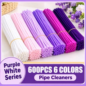 May include: A set of 600 pipe cleaners in six colors, including white, light pink, light purple, medium purple, magenta, and dark purple. Each color group is bundled with a yellow rubber band. The text reads Purple White Series 600PCS 6 COLORS Pipe Cleaners.
