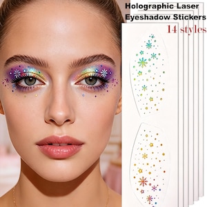 May include: Holographic laser eyeshadow stickers featuring 14 styles of snowflake and star patterns. The stickers are applied around the eyes, displaying a multi-colored, reflective finish with various small dot and geometric shapes.