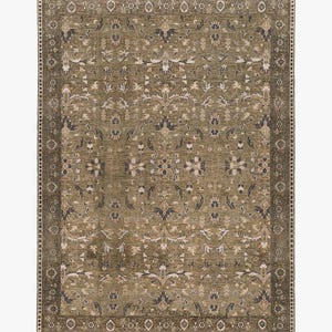 May include: A rectangular area rug featuring an olive green base with a symmetrical floral pattern in shades of cream, dark brown, and charcoal. The rug has a wide decorative border with repeating geometric motifs and a short fringe on the ends.