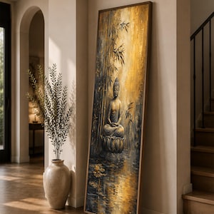May include: A tall, rectangular framed wall art piece featuring a painting of a Buddha figure sitting in a meditative pose on a lotus flower. The scene includes bamboo stalks and water reflections in shades of gold, black, and dark gray tones.