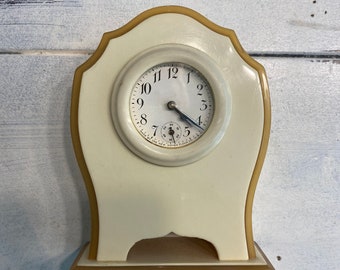 Reloj Art Déco vintage de celuloide y baquelita