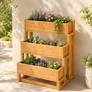 May include: A three-tiered wooden planter stand with a natural light brown finish. Each of the three rectangular levels is filled with a variety of green foliage and small pink, purple, and white flowers, creating a cascading garden display.