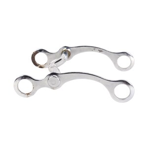 May include: A silver-coloured metal horse bit featuring two curved side shanks, each with a circular ring at both ends. The hardware displays a smooth, polished finish with minor signs of oxidation and rust visible around the circular attachment points.