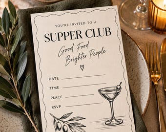 May include: A cream-coloured rectangular invitation card with a scalloped border featuring the text "YOU'RE INVITED TO A SUPPER CLUB Good Food Brighter People" and lines for date, time, place, and RSVP. It includes black ink illustrations of a martini glass and an olive branch.