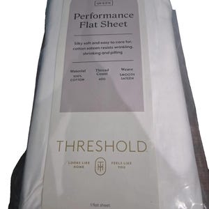 May include: A white Queen size flat sheet packaged in clear plastic with a label reading Threshold Performance Flat Sheet, 100% cotton, 400 thread count, and smooth sateen weave. The label also includes the text Looks Like Home Feels Like You.
