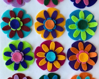 192 die cut felt flower pieces, jewel tone colors 4 layer flowers 12 colors 4 pieces per flower 4 flowers per color back to school