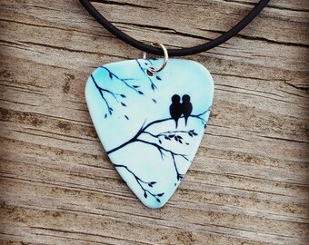 Light Blue Sky Love Birds silhouette guitar pick on black necklace with tree background - Gorgeous and Unique!