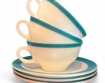 Vintage Pyrex theekopje en schoteltje met turquoise blauwe rand, set van drie.