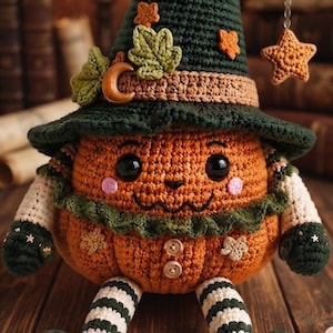 May include: A crocheted pumpkin doll wearing a dark green pointed hat adorned with a crescent moon, leaves, and a dangling star. The orange pumpkin body features a stitched face, pink cheeks, two buttons, and green ruffled trim. It has striped legs and dark green curled shoes.
