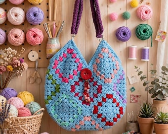 A fun handbag crocheted bag, fully lined and embellishment with a fun crocheted handle, approximately fourteen inches, free shipping