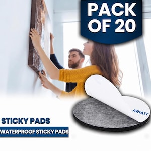 May include: A pack of 20 round, dark grey adhesive pads with a white peel-off backing featuring the blue text ARIATI. These waterproof sticky pads are designed for mounting items to walls, shown here in a circular shape with a textured surface.
