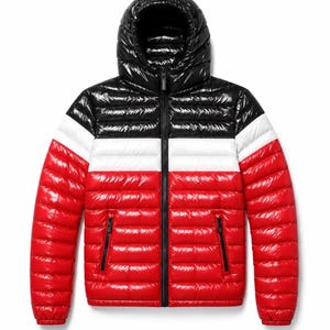 May include: A shiny, quilted puffer jacket featuring a colour-blocked design with a black hood and upper chest, a white horizontal stripe across the middle, and a bright red lower section. It includes a full-length black front zip and two pockets.