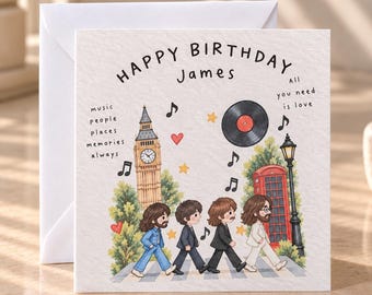 Può includere: Un biglietto d'auguri quadrato con l'illustrazione Happy Birthday James, quattro figure che camminano sulle strisce pedonali, il Big Ben, una cabina telefonica rossa, un disco in vinile, note musicali, stelle, cuori e il testo All you need is love.