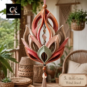 May include: A hanging lotus-shaped ornament crafted from layered crochet fabric in shades of orange, pink, and sage green. The center features a vertical string of beads and a clear crystal pendant, finished with a tassel at the bottom.