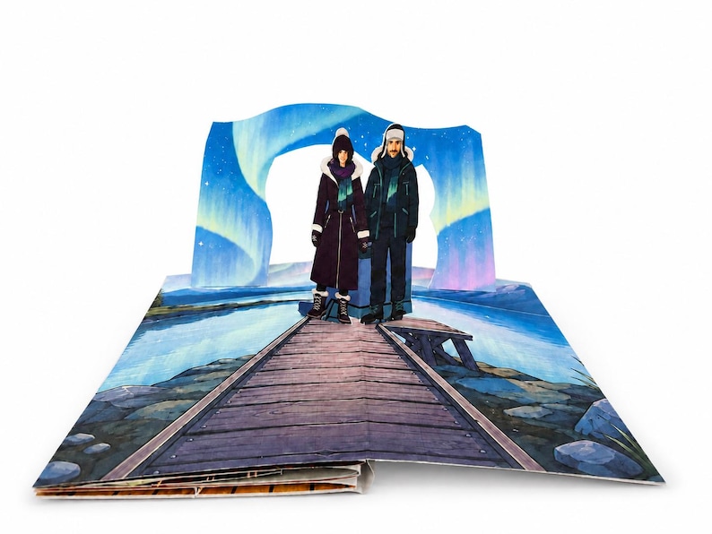 May include: A pop-up book spread featuring a three-dimensional illustration of two figures standing on a wooden pier. The background displays a vibrant blue and purple aurora borealis over a lake. The figures wear dark winter coats and hats.