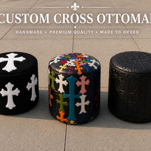 May include: Three cylindrical ottomans labeled CUSTOM CROSS OTTOMAN. The left is black with white cross appliques. The center is black with multicolored cross appliques. The right is black with embossed cross patterns across the entire surface.