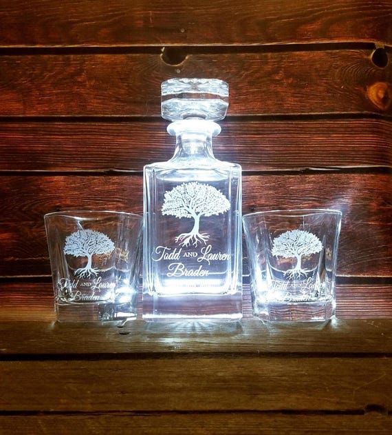 A Tree of Life motif hand-engraved on a full decanter-and-rocks-glass set — elevated, romantic, and genuinely table-worthy as a wedding gift.