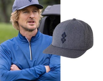 May include: A grey baseball cap with a heathered texture and a dark blue embroidered diamond-shaped logo on the front panel. The cap features a structured crown, a flat brim, and perforated side panels for ventilation, providing a clean look.