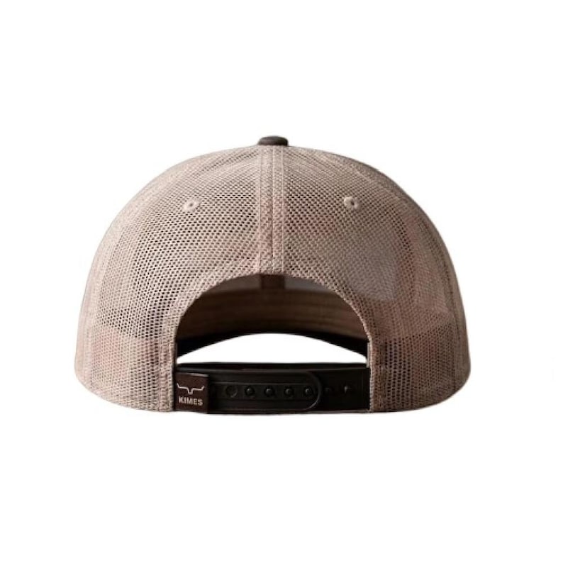 May include: A beige mesh trucker hat featuring a dark brown adjustable snapback closure. The back strap includes a small dark brown rectangular tag with the text Kimes and a small bull horn logo printed in white on the left side.