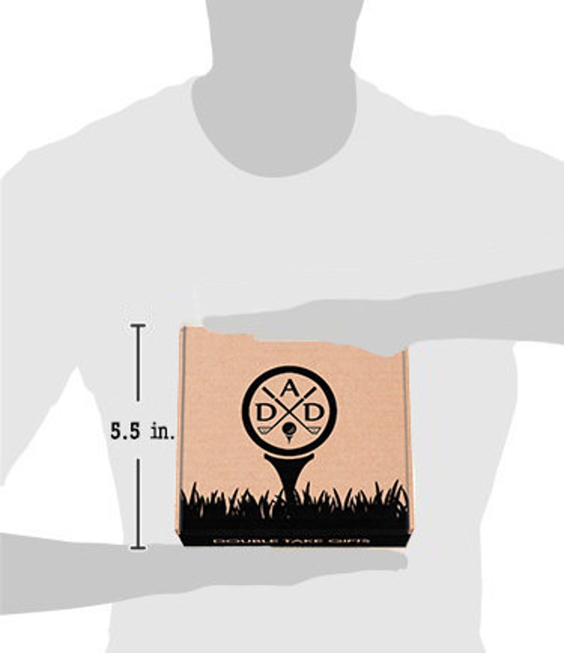 May include: A brown cardboard box with a black logo of two crossed golf clubs and the letters "A D D" inside a circle. The logo is on top of a golf tee and green grass. The text "DOUBLE TAKE GIFTS" is printed on the bottom of the box. The box is 5.5 inches tall.