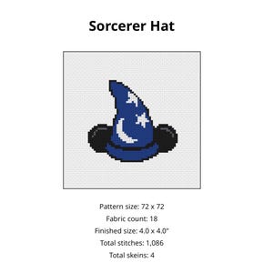 May include: A cross-stitch pattern of a blue sorcerer hat with white moon and star motifs, featuring black mouse ears. The text reads Sorcerer Hat, pattern size 72 x 72, fabric count 18, finished size 4.0 x 4.0 inches, 1,086 stitches, and 4 skeins.