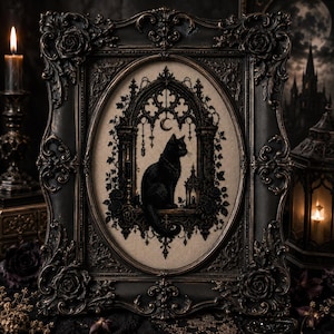 May include: A black cat silhouette is embroidered in black thread on a beige fabric background, framed within an ornate, dark, rectangular frame with intricate floral carvings and an oval inner border featuring a gothic archway and a crescent moon.