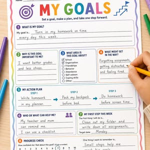 Op de afbeelding: Een werkblad voor het stellen van doelen, getiteld MY GOALS, met een regenboogrand. Het formulier bevat secties voor doeldefinitie, actieplannen en voortgangscontroles, met handgeschreven tekst zoals Turn in my homework on time.