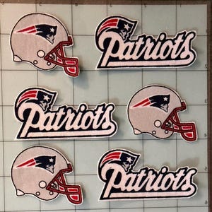 May include: Three embroidered patches shaped like silver football helmets with red face masks and the Patriots logo, and three embroidered patches featuring the word Patriots in a stylized navy blue and white font with the team logo emblem.