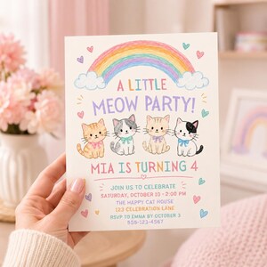 May include: A rectangular party invitation card featuring a colourful hand-drawn rainbow above four illustrated kittens with bows. The text reads A LITTLE MEOW PARTY! MIA IS TURNING 4, followed by event details including date, time, location, and RSVP phone number.
