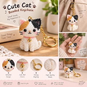 May include: A beaded keychain shaped like a calico cat with white, orange, and black beads. The cat features black eyes, pink cheeks, and a gold-toned collar with a small bell. A gold-colored metal ring is attached to the top of the cat figure.