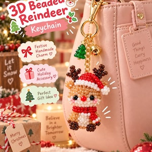 May include: A 3D beaded reindeer keychain featuring a tan, white, and dark brown beaded reindeer wearing a red and white beaded Santa hat and a red scarf. The keychain includes a gold-tone metal clasp, a small green tree charm, and a bell.