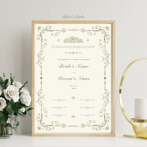May include: A vertical rectangular marriage certificate in a light wood frame featuring ornate green and gold filigree borders. The document includes Arabic calligraphy, English text, blank lines for names, dates, and signatures, and a cream background.