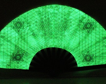 Sacred G Clack Fan- Glows in the Dark All Over. Black and White Printed Design includes FREE Mini Black light FREE Shipping