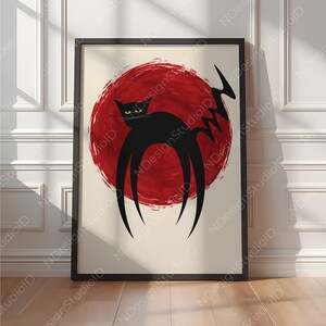 以下が含まれることがあります： アーチ状の背中と黄色い目を持つ様式化された黒猫が描かれた額入りアートプリント。クリーム色の背景に、質感のある大きな赤い円形の筆致が施されています。猫には長く尖った脚とジグザグの尻尾があります。