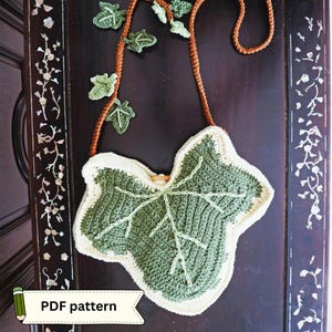 May include: A crochet bag shaped like a large ivy leaf in shades of dark green and cream, featuring a long brown strap adorned with smaller crocheted leaves. A white banner with a green pencil icon and the text PDF pattern is visible.