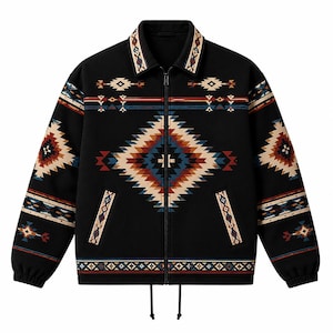May include: A black zip-up jacket featuring a prominent geometric pattern in shades of cream, blue, and rust orange. The design includes a large central diamond motif, horizontal bands on the sleeves, collar, and hem, and two front pockets.