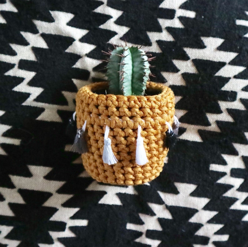 Recycled Yarn by Chimps Tea Party mustard with monochrome tassels Crochet cactus cosy