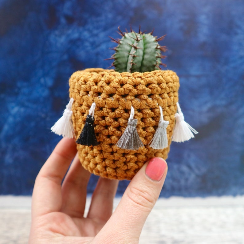 Recycled Yarn by Chimps Tea Party mustard with monochrome tassels Crochet cactus cosy