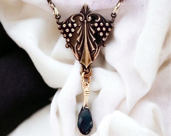 Stunning antiqued brass pendant with Kabela component and denim blue Swarovski briolette