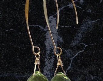 Stunning long plump green amethyst faceted crystal briolette earrings set on a lovely gold ear wire.