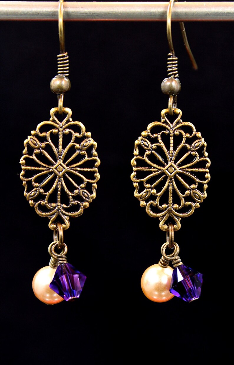 Antiqued brass and pearl earrings. Etsy